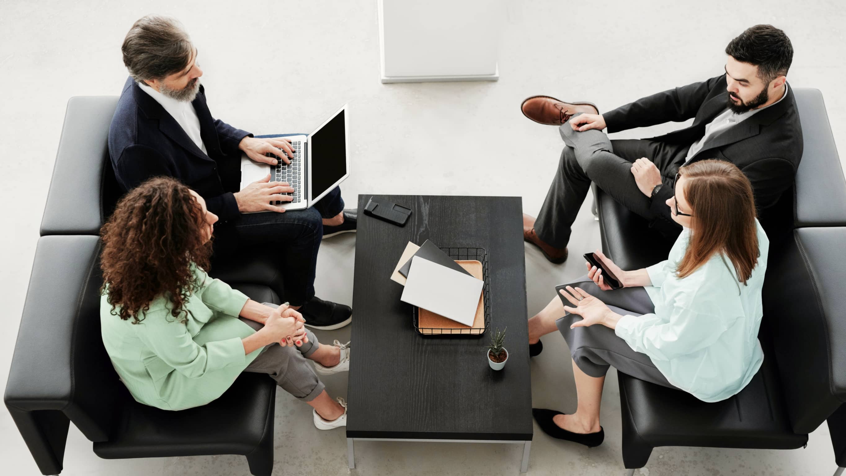 Four People Work Meeting - Accountant X Modern Website Template